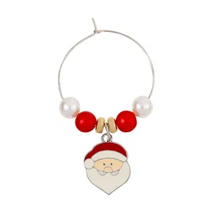 Detail of Christmas wine glass charm featuring Santa Claus pendant and festive beaded ring