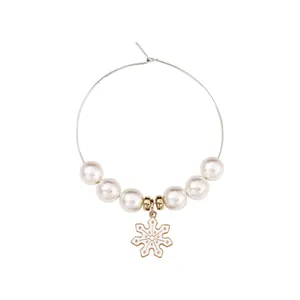 Christmas wine glass charm with gold metal hoop, white pearls and snowflake pendant