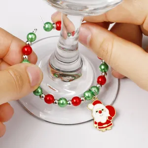 Christmas themed wine glass charm with Santa pendant and festive red green beads