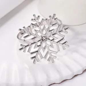 Macro view of silver snowflake napkin ring with clear crystal centerpiece detail