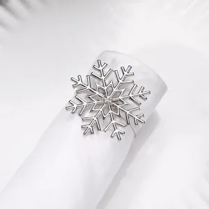 Macro shot of silver snowflake napkin ring with a sparkling crystal center detail