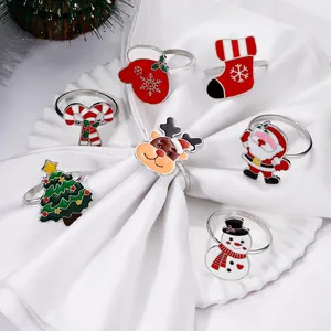 7-piece set of silver Christmas napkin rings with enamel Santa and reindeer icons