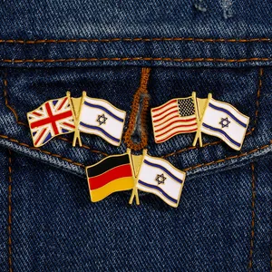 Detail of USA and Israel double flag enamel pin on blue denim fabric background