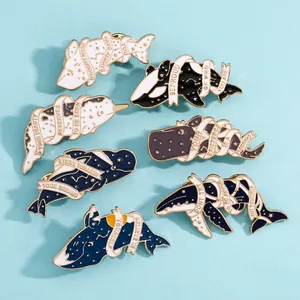 Set of 7 ocean enamel pins with whales and inspirational quotes on blue background