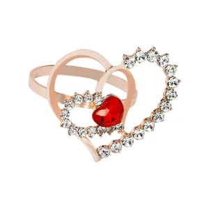Rose gold interlocking heart napkin ring with sparkling crystals and red heart gemstone