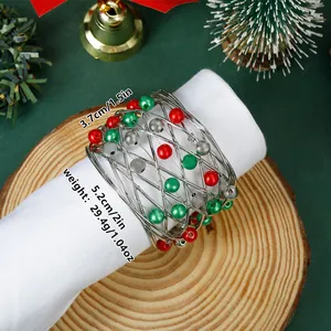 Detailed view of silver wire Christmas bell napkin ring with red beads and dimensions