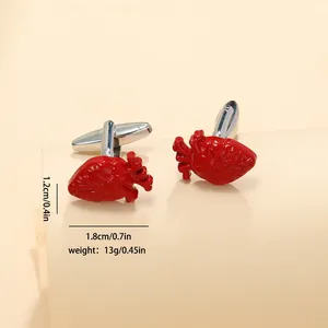 Detail view of red anatomical heart cufflinks for men with size and weight dimensions