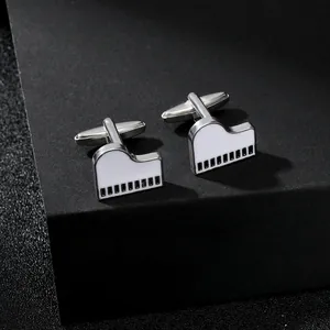 Macro shot of creative piano-shaped cufflinks with black and white enamel keys