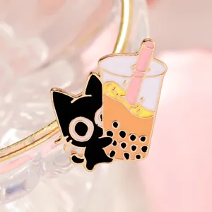 Detail of enamel cat and bubble tea pin showing gold plating and high-quality craftsmanship