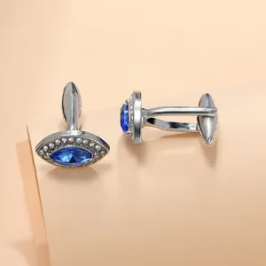 Close-up of marquise-cut blue stone cufflinks with silver metal and T-back clasp