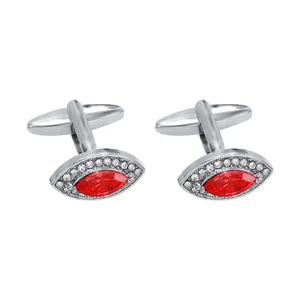 Silver cufflinks with eye-shaped red zircon stones and small white crystal pavé setting