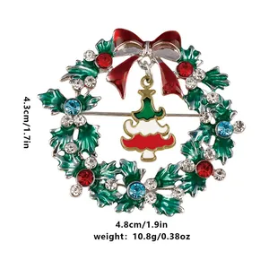 Detail view of a Christmas wreath brooch with colorful rhinestones and dimensions shown