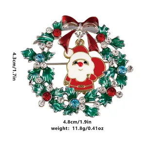 Detailed view of Christmas wreath brooch with red bow and Santa pendant, 4.3x4.8cm size
