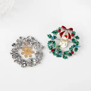 Christmas wreath brooches with green enamel, rhinestones and cute snowman pendant