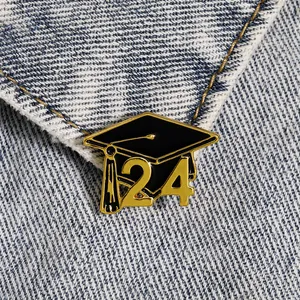 2024 Graduation cap enamel pin with gold tassel on denim jacket for student gift