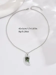 Detail of crescent moon pendant necklace with marble texture and adjustable silver chain