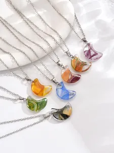 Radial display of colorful crescent moon stone pendants with silver necklaces