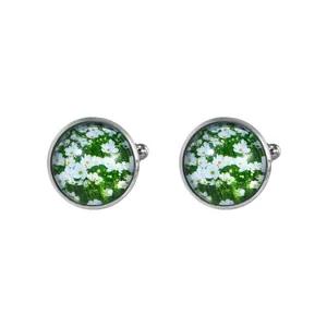 Vintage round daisy cufflinks with silver metal base and floral glass gem pattern