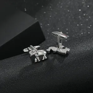 Detailed view of silver elephant cufflinks with polished metallic finish for men
