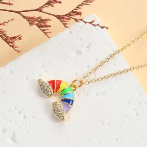 Gold plated rainbow enamel pendant necklace with sparkling cubic zirconia on a cable chain