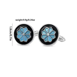 Detailed view of silver cufflink with blue floral pattern and 1.8cm diameter marking