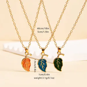 Three colorful leaf enamel pendants in orange blue green with gold-tone link chain set