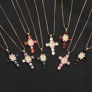 Detail of colorful cross necklaces with Virgin Mary medals and teardrop zirconia stones