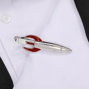 Detailed view of creative rocket shaped silver metal tie clip on a white formal shirt
