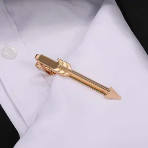 Mens golden arrow tie clip on black suit and white shirt with professional 45-degree angle