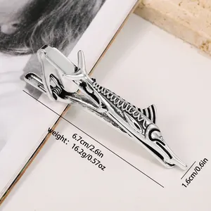 Close-up of a silver swordfish tie clip showing scale texture and detailed dimensions