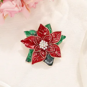Eleganter Poinsettia-Anstecknadel mit roter Emaille und funkelnden weißen Strasssteinen