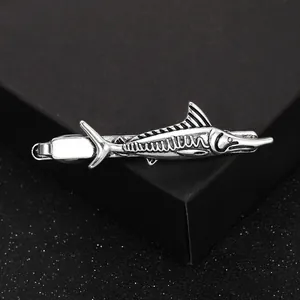 Close-up of vintage silver sailfish tie clip on a luxury black gift box for men