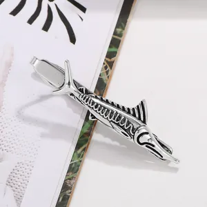 Detail of vintage silver swordfish tie clip showing intricate scale textures and spring clasp