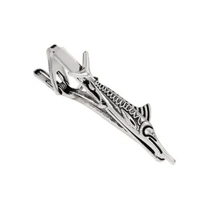 Detailed macro view of silver swordfish tie clip showing intricate skeletal texture