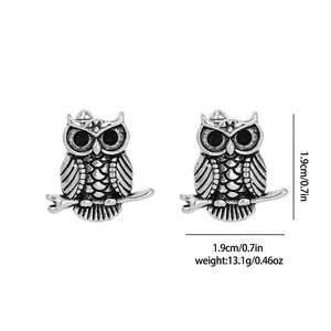 Macro detail of retro owl cufflinks with fine relief patterns and size dimensions