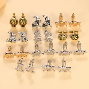 Detailed close-up of metallic animal-shaped cufflinks featuring lion, tiger and elephant designs