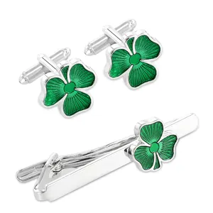 Men's silver cufflinks and tie clip set with green four-leaf clover enamel design