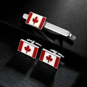 Detail of Canadian flag cufflinks and tie clip set with red enamel maple leaf in a gift box