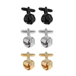 Three pairs of twist silk knot cufflinks in black, silver, and gold plated metal