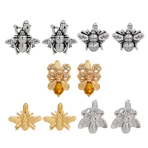 Set di cinque gemelli a forma di ape con strass e dettagli in ambra dorata