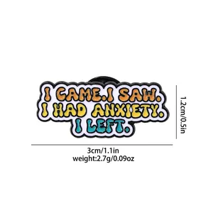 Macro view of alloy enamel brooch with colorful typography and dimensions of 3cm x 1.2cm