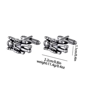 Detailed close-up of astronaut cufflinks showing dimensions and silver metallic texture