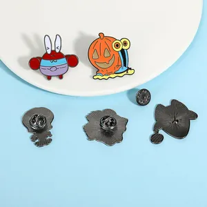 Detailed view of cartoon enamel pins featuring sea creature designs and metal backings