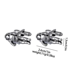 Macro view of astronaut cufflinks showing metal texture and dimensions for business shirts