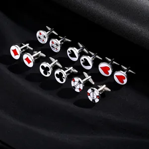 Detailed close-up of six poker-themed cufflinks on black silk, showing cards and chips