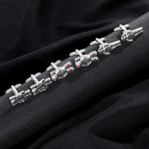 Men's silver astronaut cufflinks with red accents for business shirts displayed on black fabric