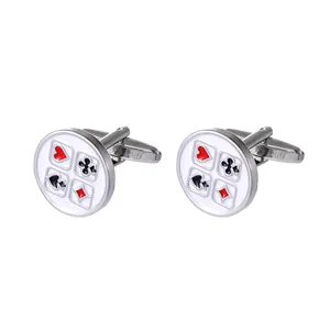 Detailed close-up of polished silver poker suit cufflinks featuring red and black enamel