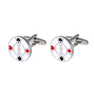Macro shot of poker chip cufflinks showing 100 dollar print and card suits