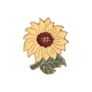 Broche tournesol créative en émail avec pétales jaunes et détails dorés en alliage