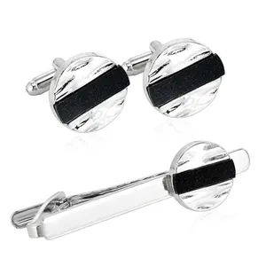Silver and black star-patterned cufflinks and tie clip set with hammered texture